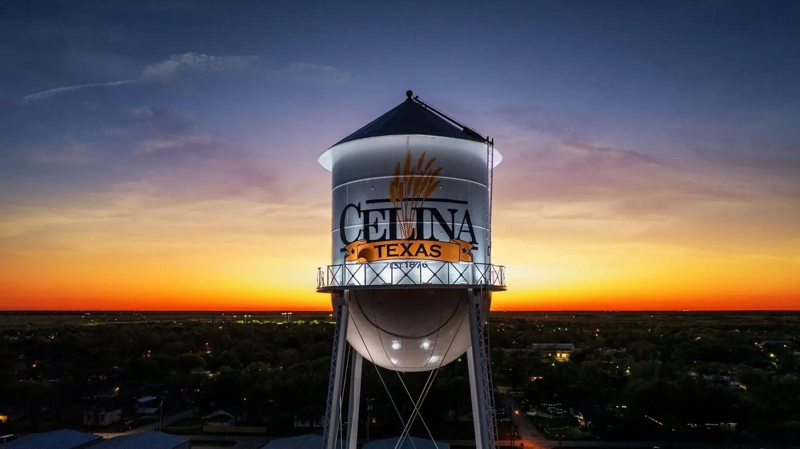 The Celina, Texas water tower at sunset, reading Celina Texas, established 1876