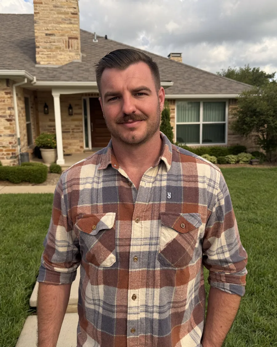 Kyle Rohlfs standing in front of a North Dallas home